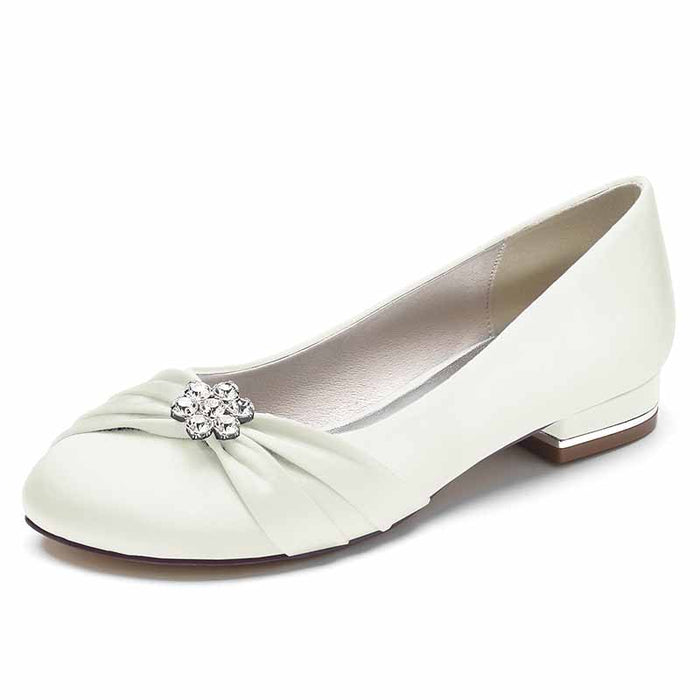 Elegant bridal satin flats for wedding with a decorative floral brooch and comfortable design