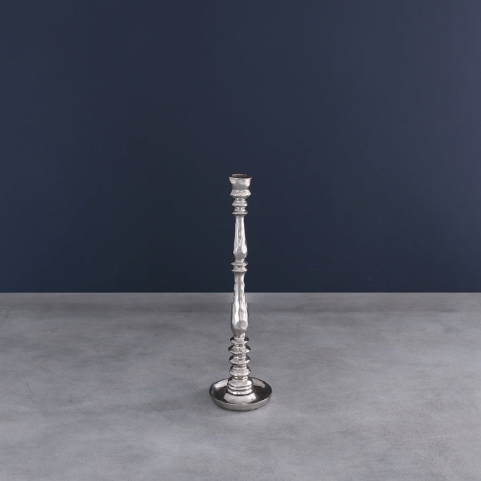 Beatriz Ball Soho Crosby Small Candlestick Holder — On a gray surface against a dark wall