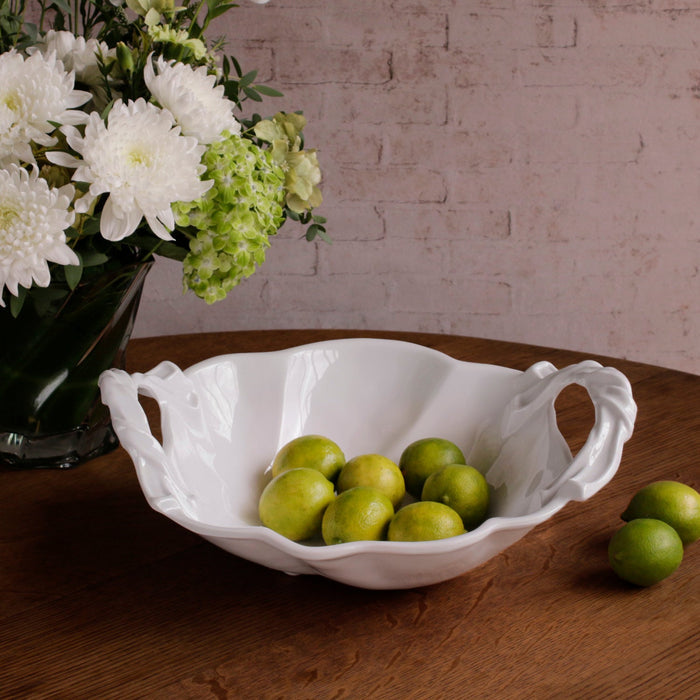Beatriz Ball Vida Sasha Round Large Bowl with Handles White — With limes on a wooden table