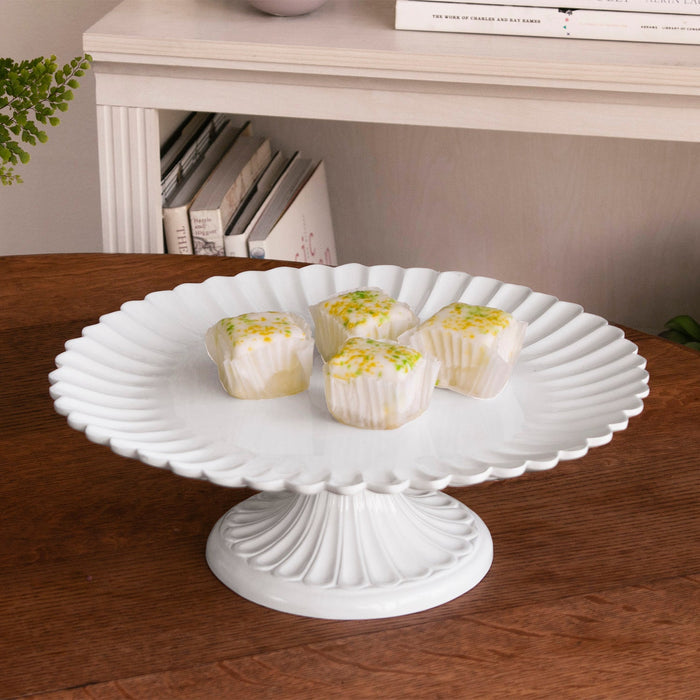 Beatriz Ball Vida Vienna Pedestal Cake Plate White — With small desserts on a console